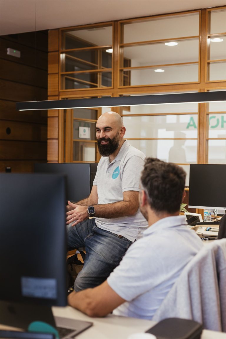 ServiceNow consultants talking at the office of Aloha Clouds - a Top ServiceNow Consulting Firm